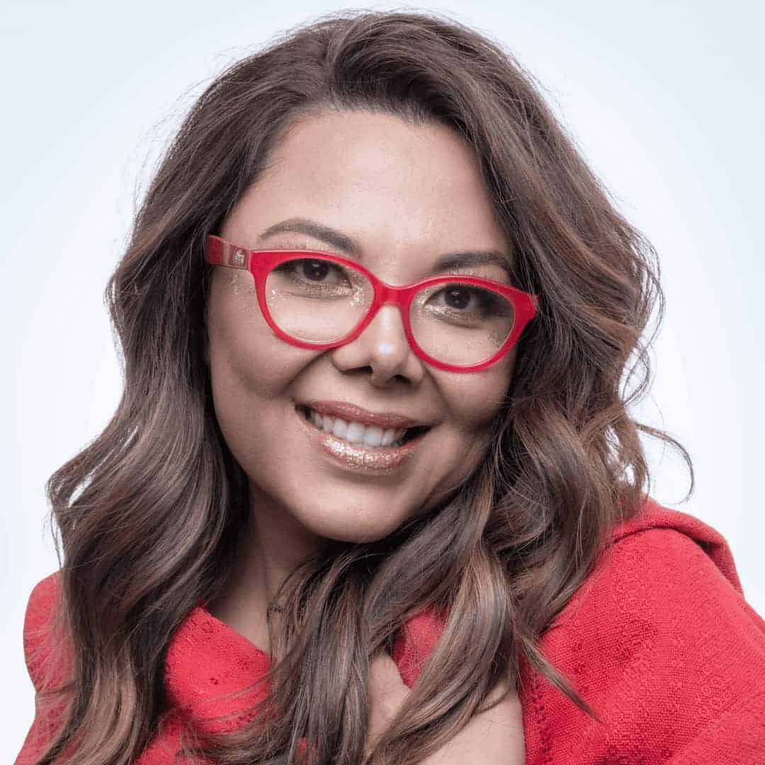 Heashot of Cristina, brown skin town, light brown and long hair, red eyes glasses and red Mexican reboso; photo Monica Solis.